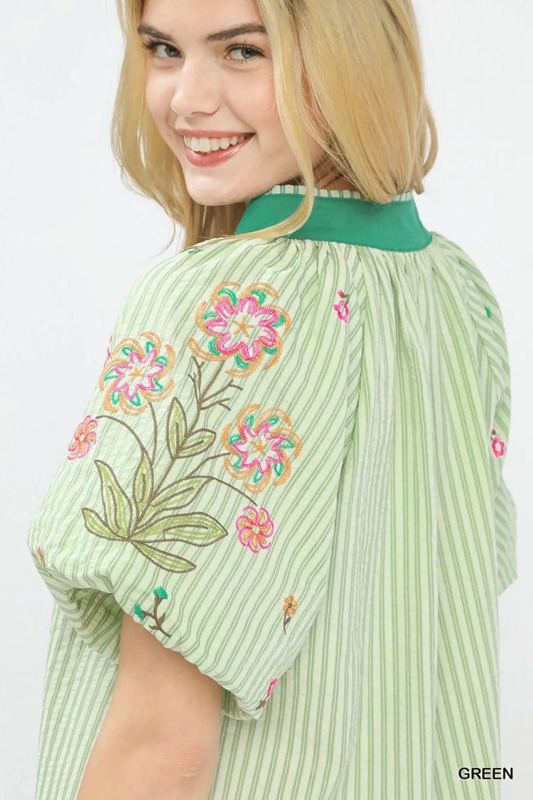 Striped top with delicate floral embroidery accents