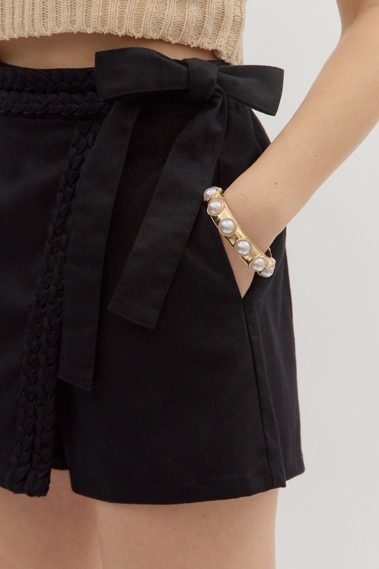 Solid wrap skort featuring trenza detail at front skirt panel