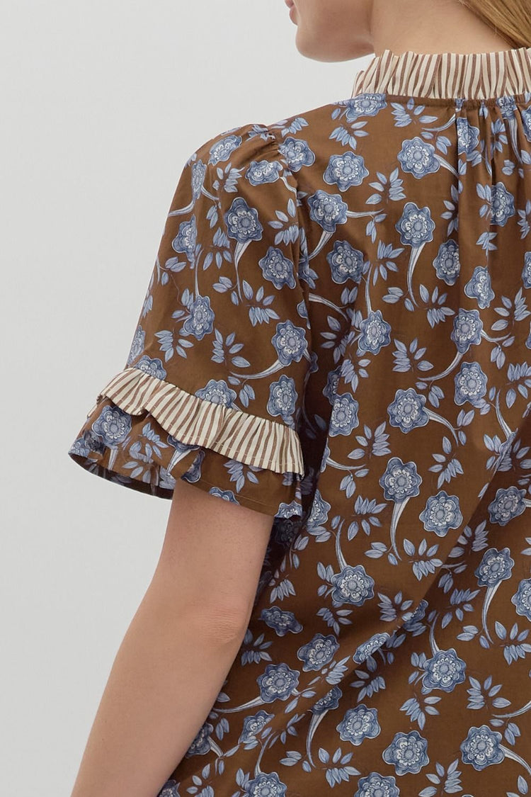 Floral print puff shoulder short sleeve pullover top featuring contrast ruffle accent neck and sleeve hem
