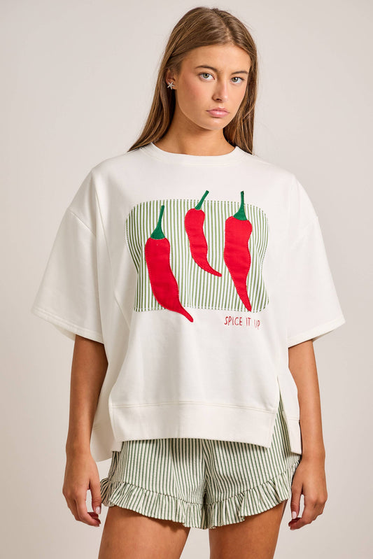 Oversized short sleeve top featuring bold chili pepper