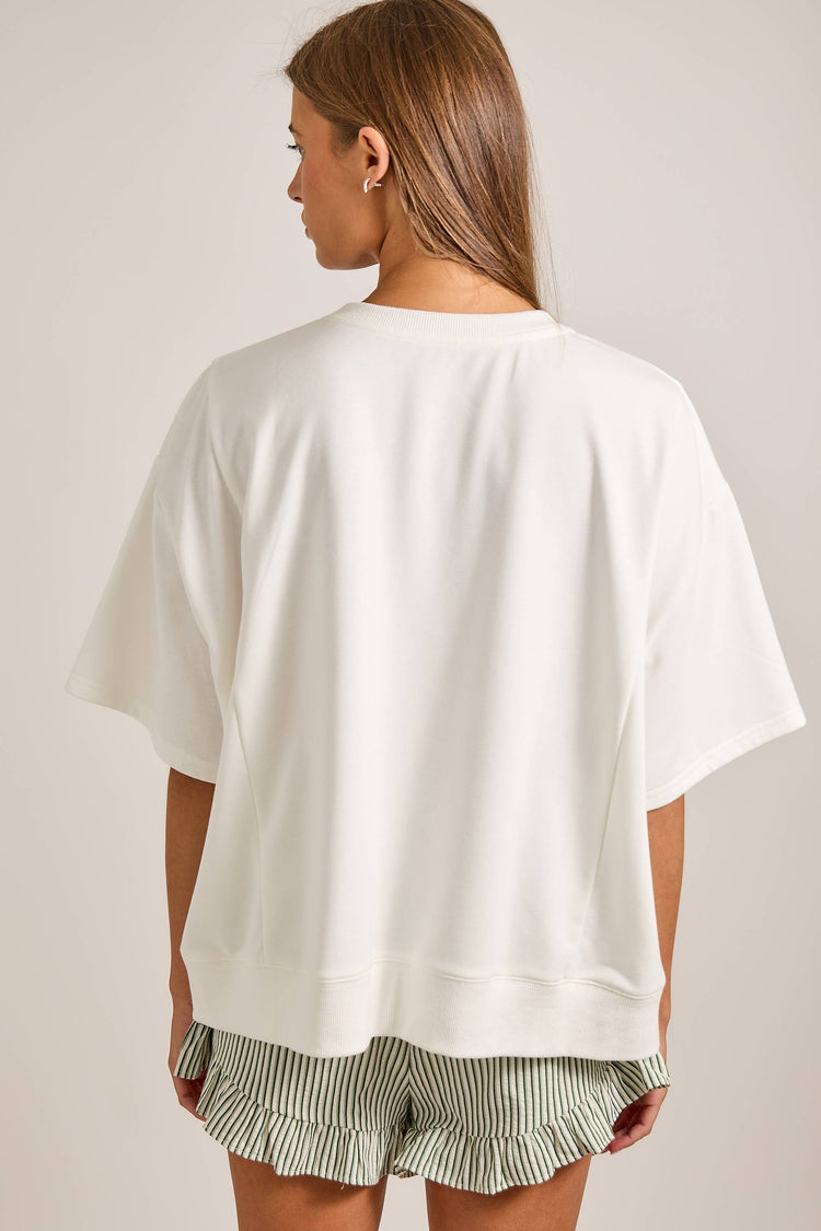 Oversized short sleeve top featuring bold chili pepper