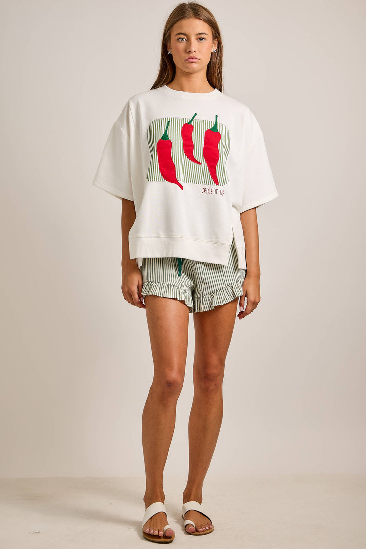 Oversized short sleeve top featuring bold chili pepper
