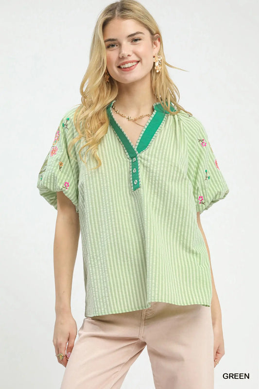 Striped top with delicate floral embroidery accents