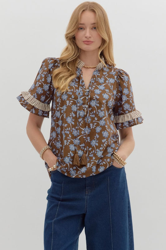 Floral print puff shoulder short sleeve pullover top featuring contrast ruffle accent neck and sleeve hem